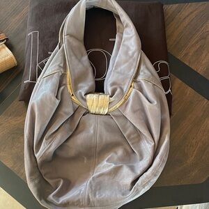 Kooba Carly leather hobo bag in a grey or lavender color with gold-tone hardware